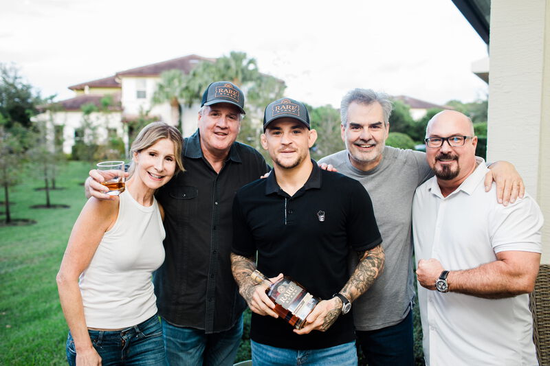 Dustin poses with some of the people on his bourbon team